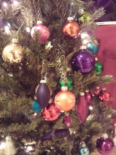 We had enough ornaments for a big tree, and you insisted on using all of them on our little one