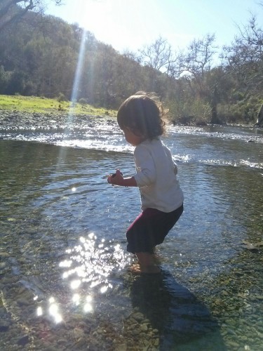As I explained to J about the water and rocks, you went into the middle of the river to find a nice round one